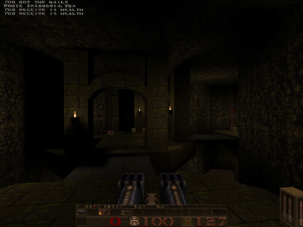 yosemite — pillared hall with three torches glowing in alcoves and arches receding into darkness