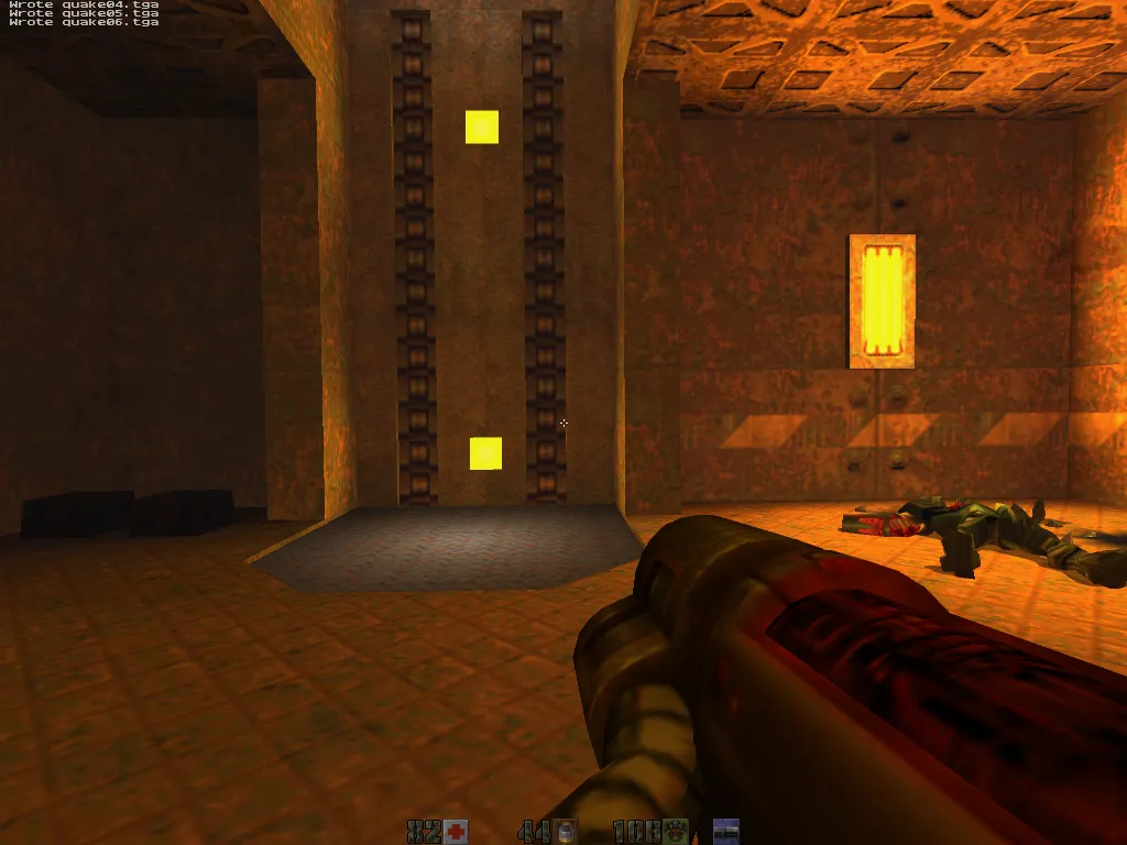 quicksilver, yellow elevator lights on a brown door, a dead Strogg slumped on the floor by an ammo crate