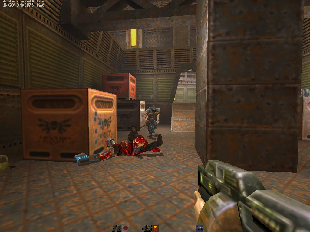 sawtooth, gibbed soldier on the floor with a Strogg approaching past green crates