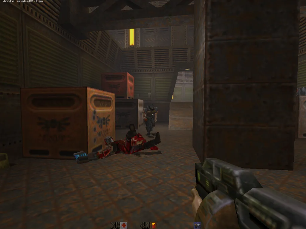 yosemite, gibbed soldier on the floor by an ammo crate with a Strogg in the doorway