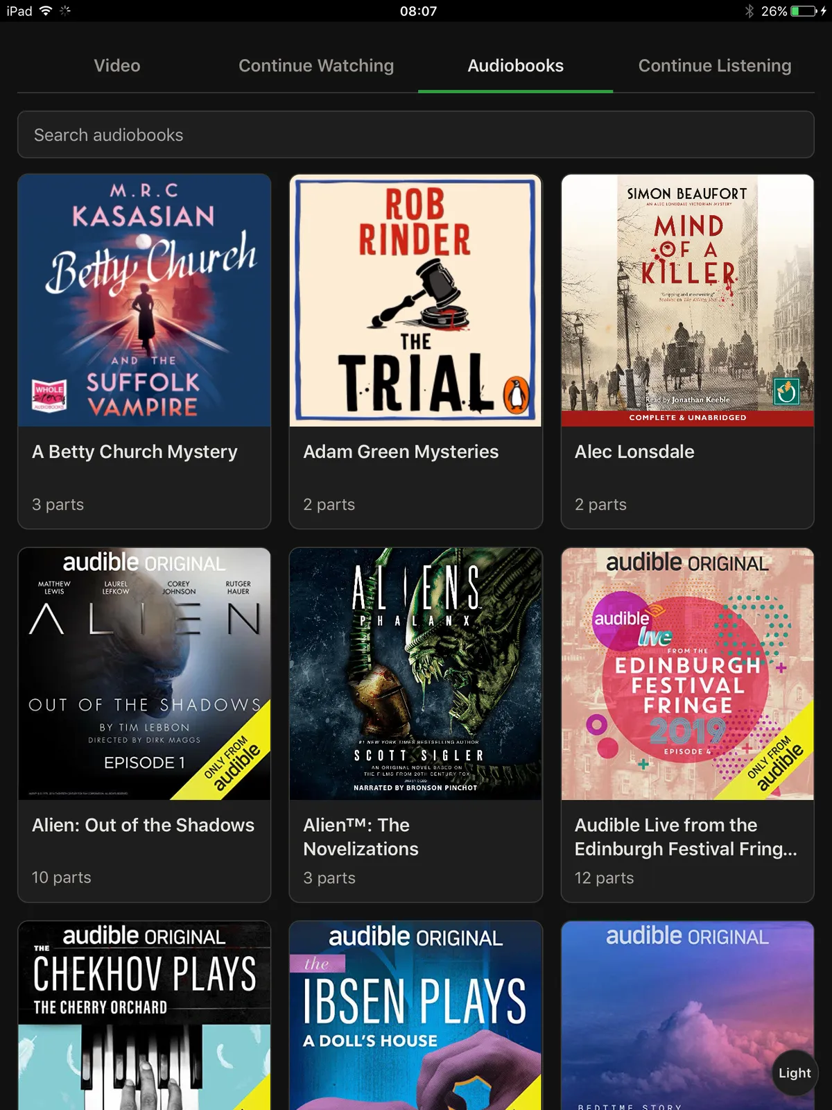 The media player's Audiobooks tab on the old iPad, with a grid of covers and a search box
