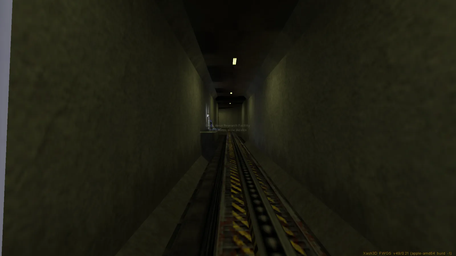 The opening tram ride through a service tunnel in Half-Life, map c0a0, lit by a single fluorescent tube