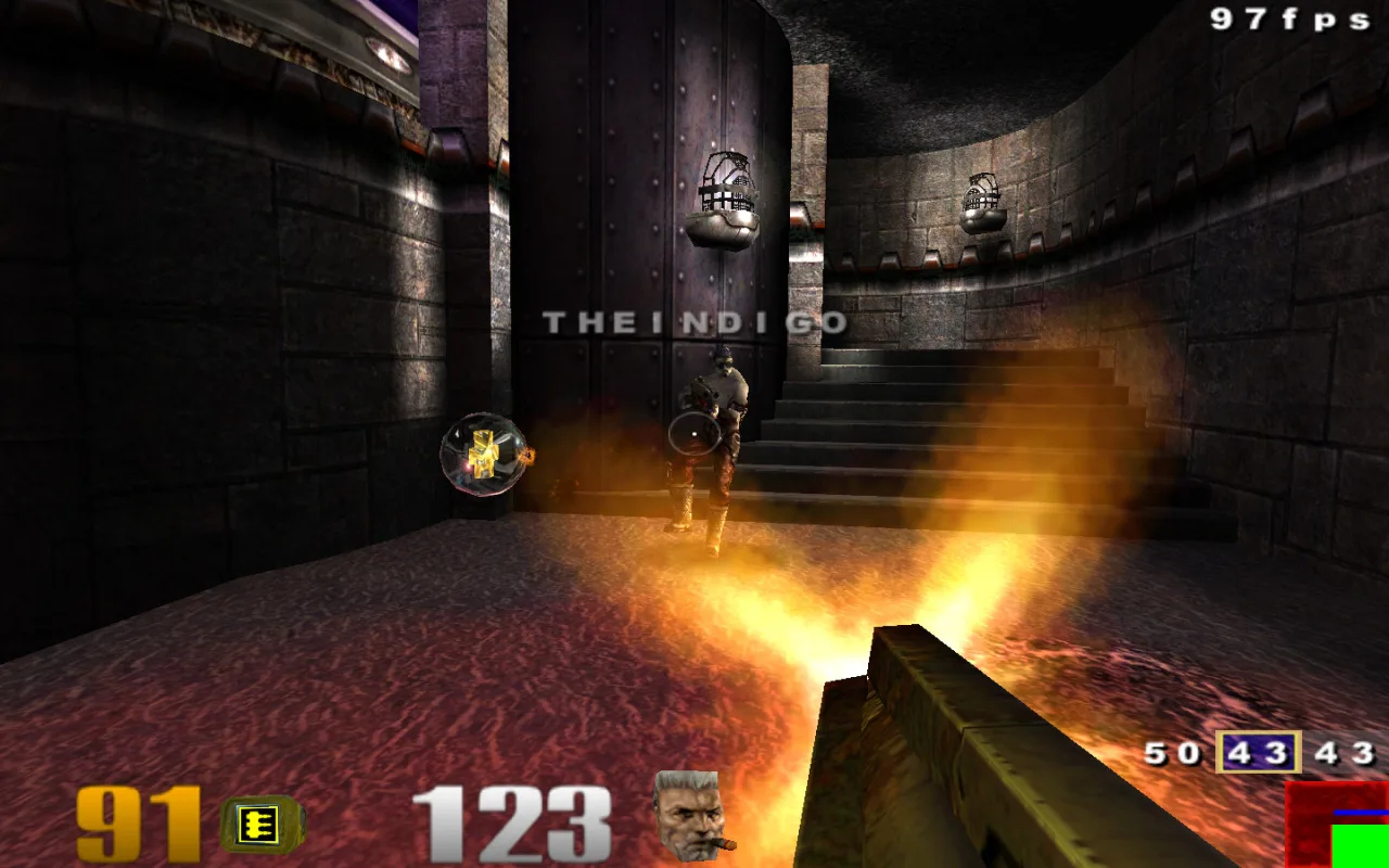 Quake III on an iMac G5 with a Radeon 9600 — a lava-floored arena with hanging cages, at 97 fps